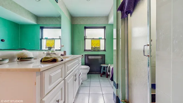 a kitchen with a sink a stove and cabinets