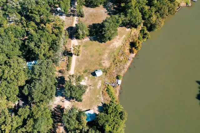 an aerial view of residential building and lake