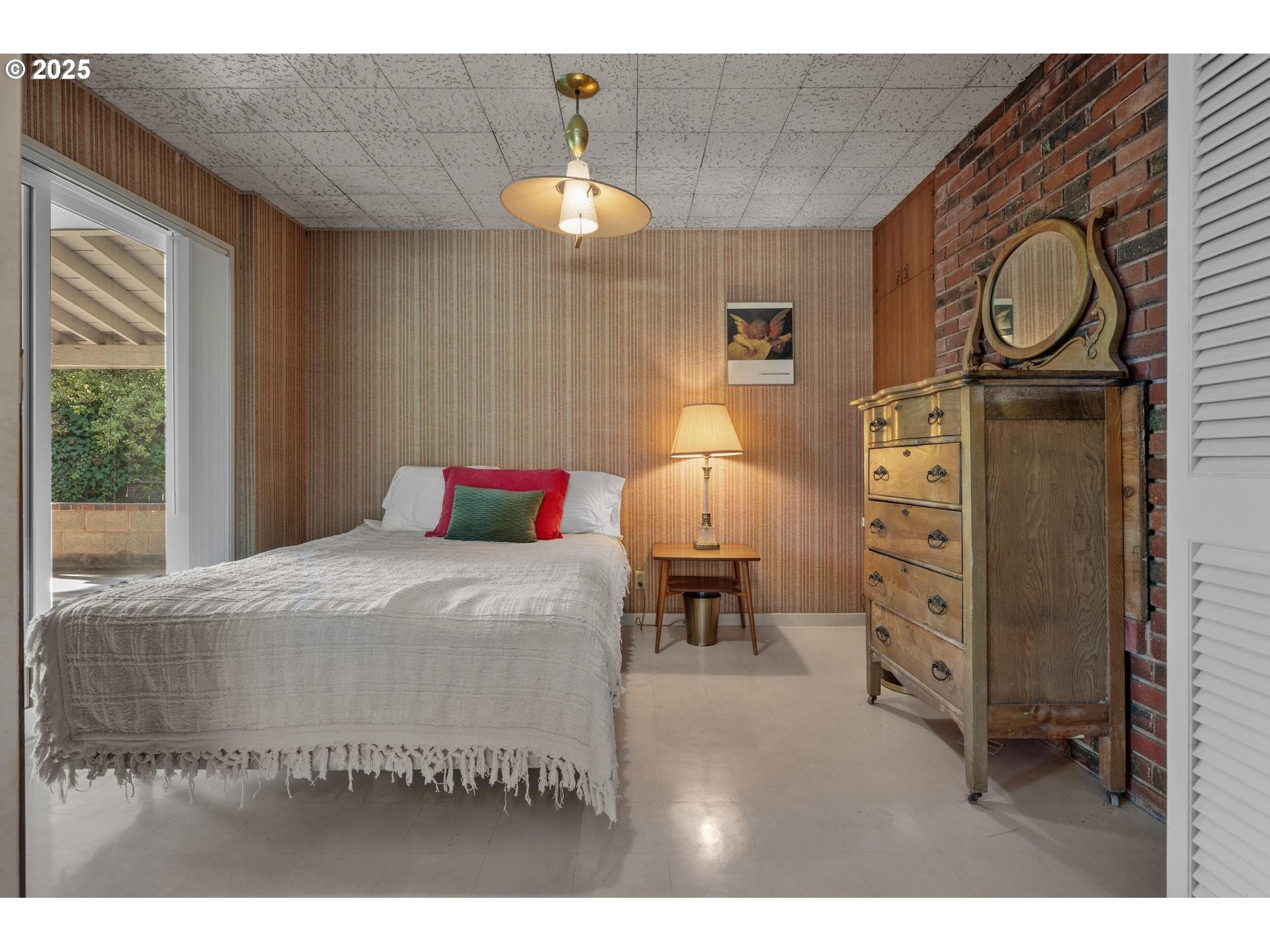 11990 Southwest Denney Road Beaverton, OR 97008 - Photo 15 of 30 a bedroom with a bed and dresser with mirror
