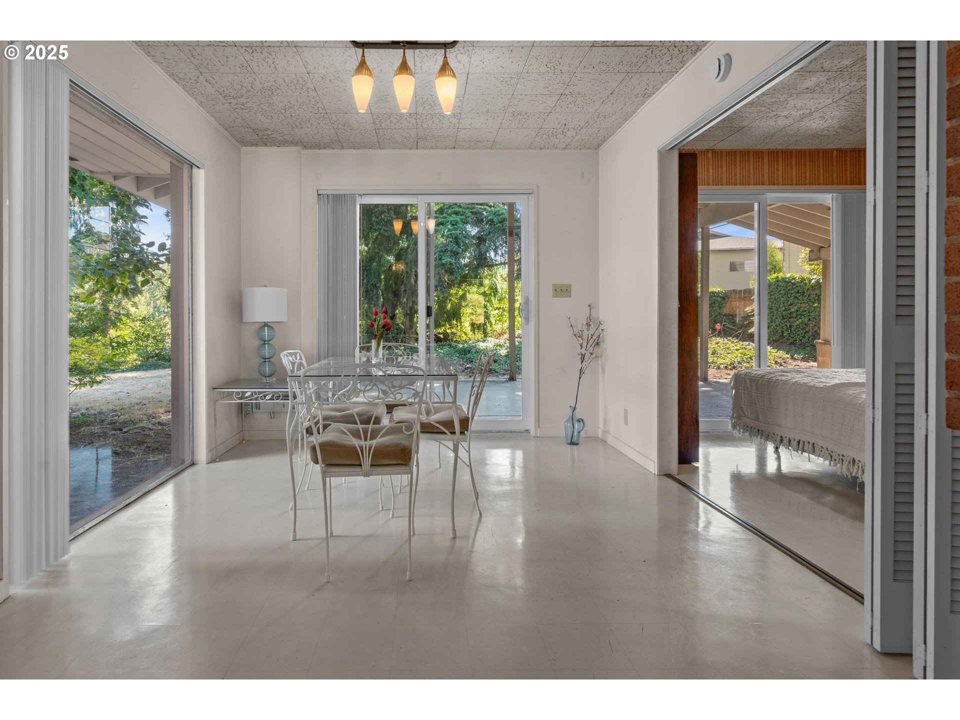 11990 Southwest Denney Road Beaverton, OR 97008 - Photo 8 of 30 a living room with furniture and a floor to ceiling window