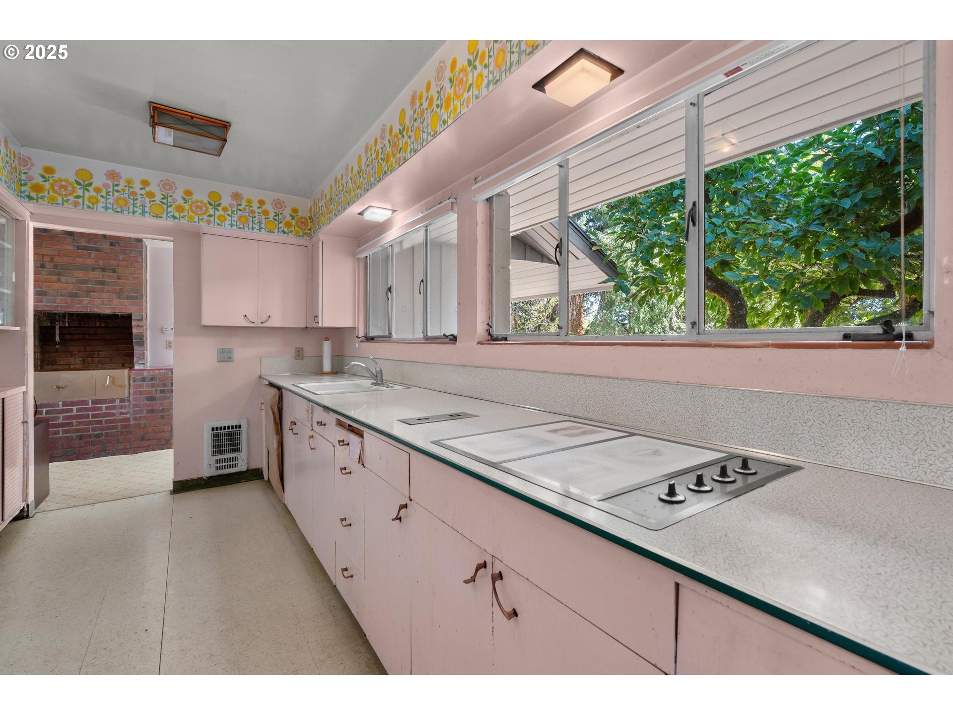 11990 Southwest Denney Road Beaverton, OR 97008 - Photo 10 of 30 a kitchen with a stove a sink and a window