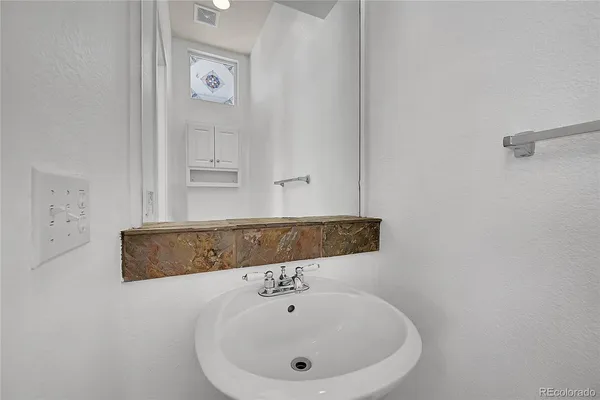 a bathroom with a bathtub and a sink