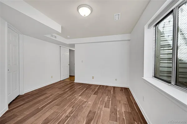 a view of room with window and hardwood floor