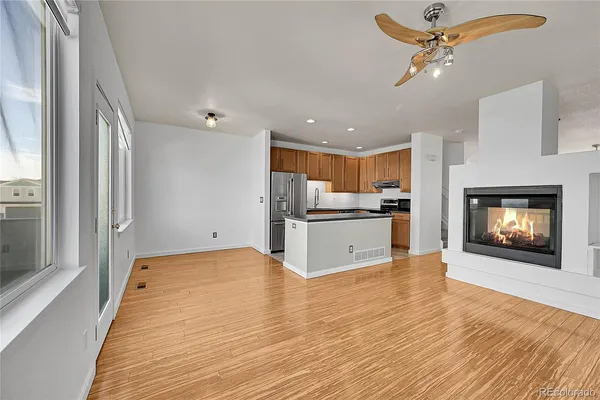 a view of a kitchen with a stove cabinets and wooden floor