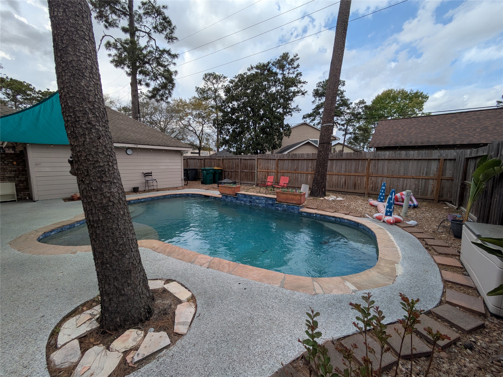 9222 Symphonic Lane Houston, TX 77040 - Photo 25 of 33 Backyard with recently resurfaced pool and dec