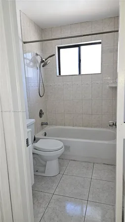 a bathroom with a toilet sink and bathtub