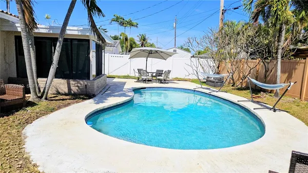 a view of a swimming pool with a lounge chairs