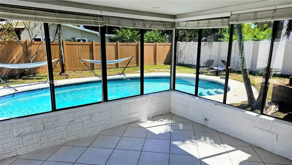 a view of an empty room with glass door
