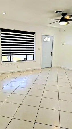 a view of kitchen and empty room