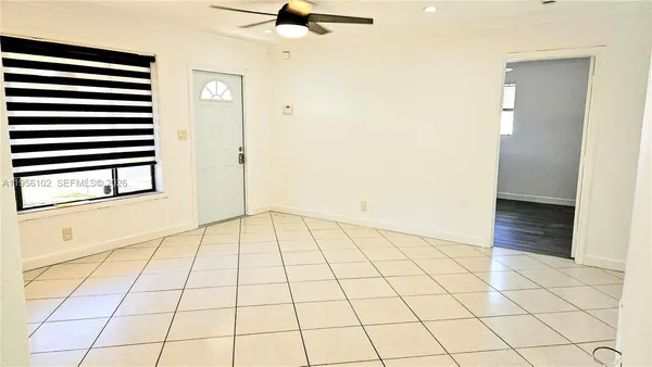 a view of an empty room and window