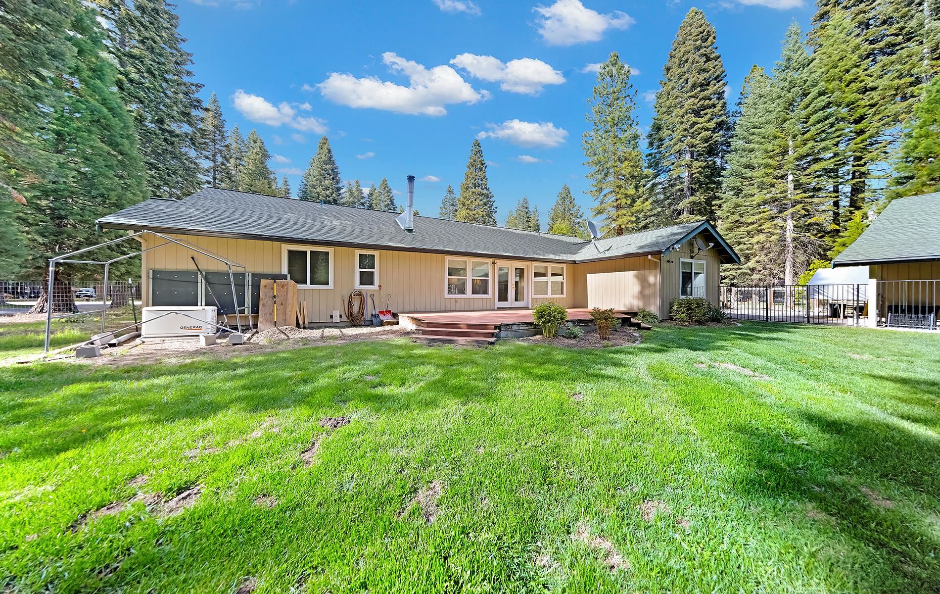 650 Wagon Road Chester, CA 96020 - Photo 23 of 36 a view of a house with backyard and sitting area