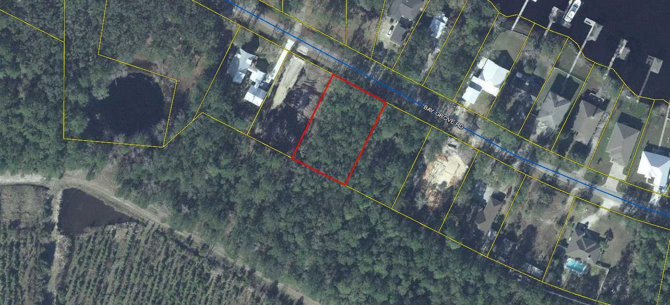 .57-acres Bay Grove Road Freeport, FL 32439 - Photo 7 of 10 a backyard of a house with lots of green space