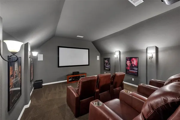 a projector room with furniture a projector and screen