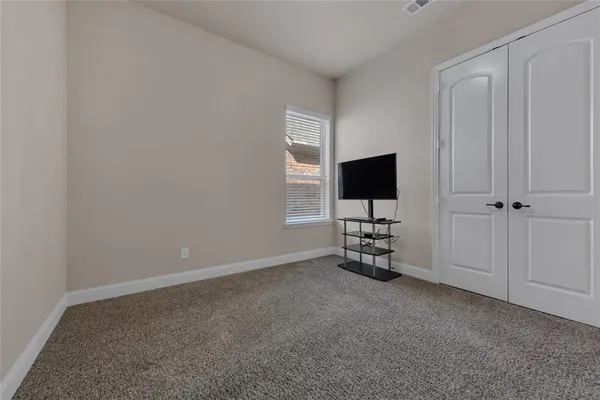 a view of a livingroom with a flat screen tv