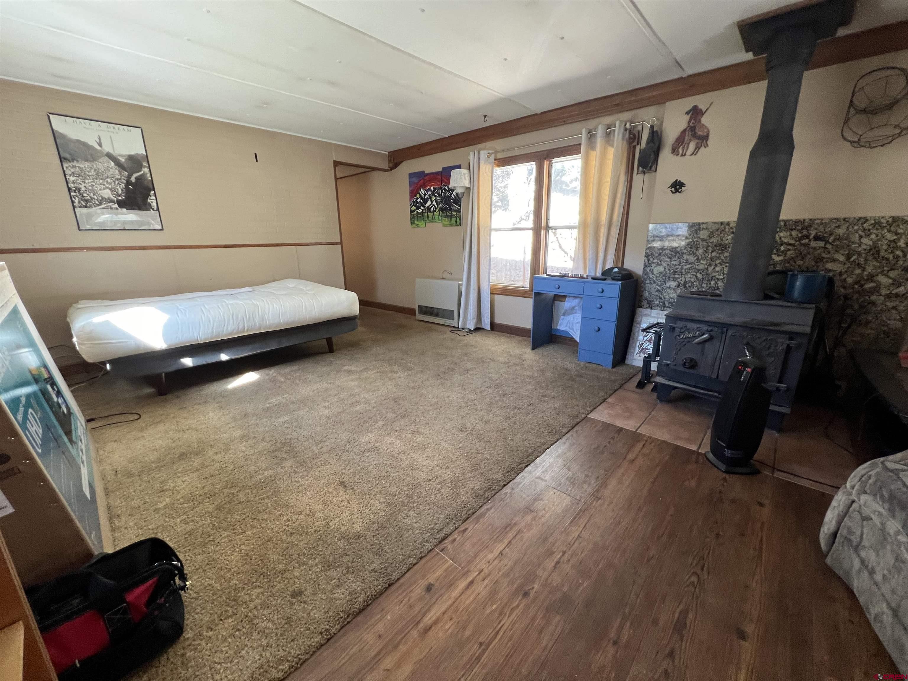 62 Range View Trail Ridgway, CO 81432 - Photo 11 of 21 a bedroom with furniture and a window