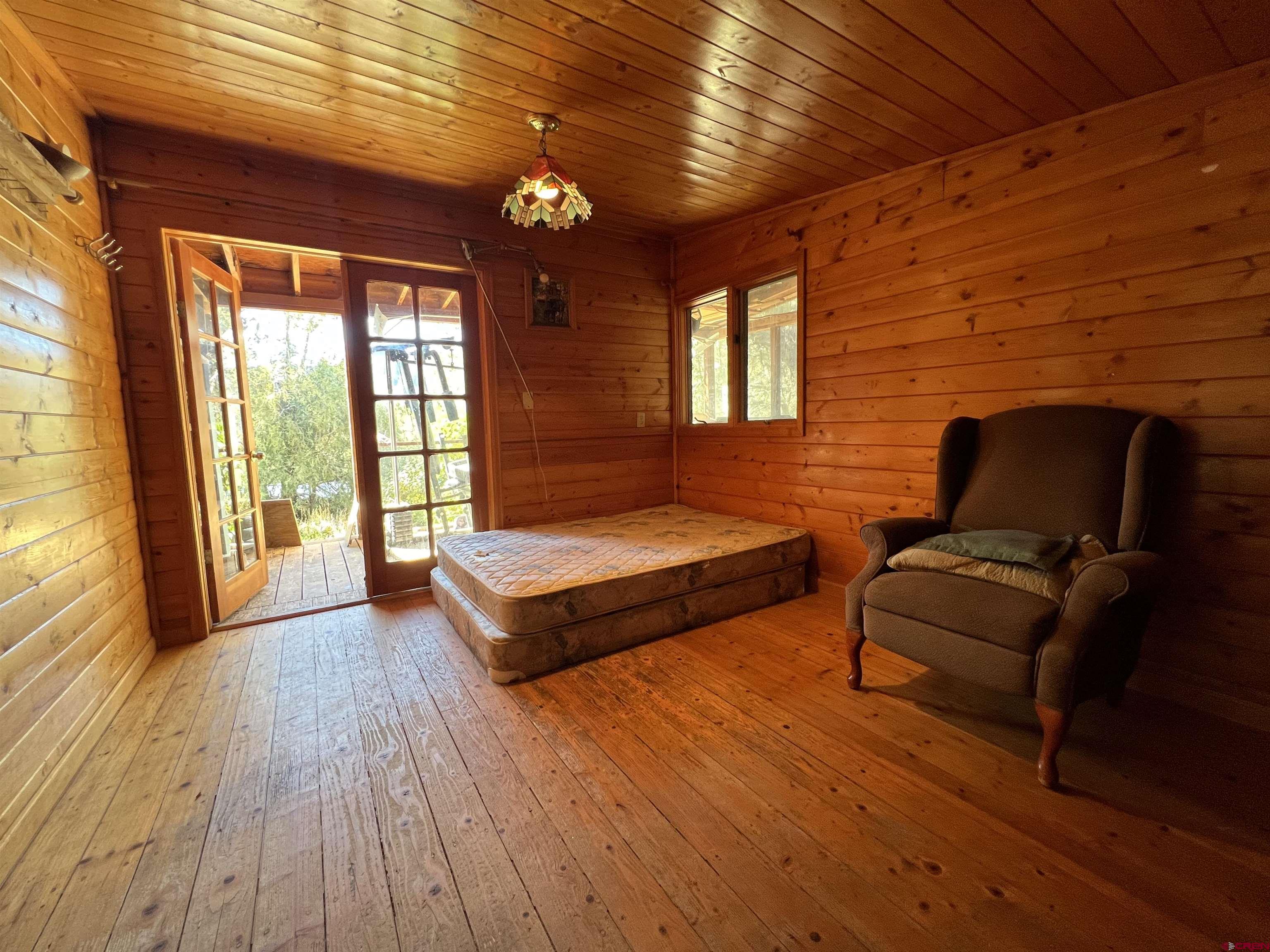 62 Range View Trail Ridgway, CO 81432 - Photo 14 of 21 a bedroom with furniture and wooden floor