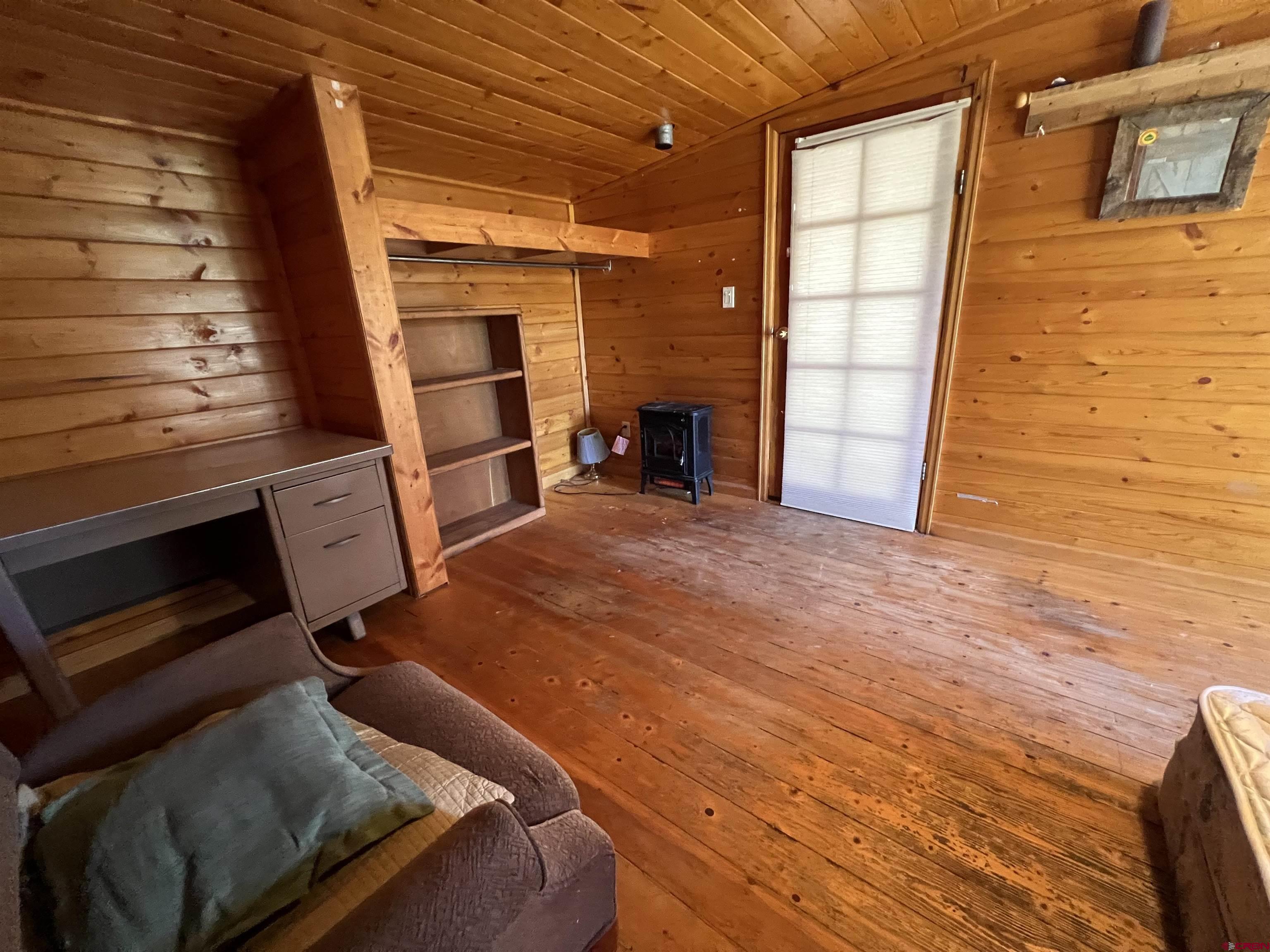 62 Range View Trail Ridgway, CO 81432 - Photo 15 of 21 a view of a room with wooden floor and brick walls