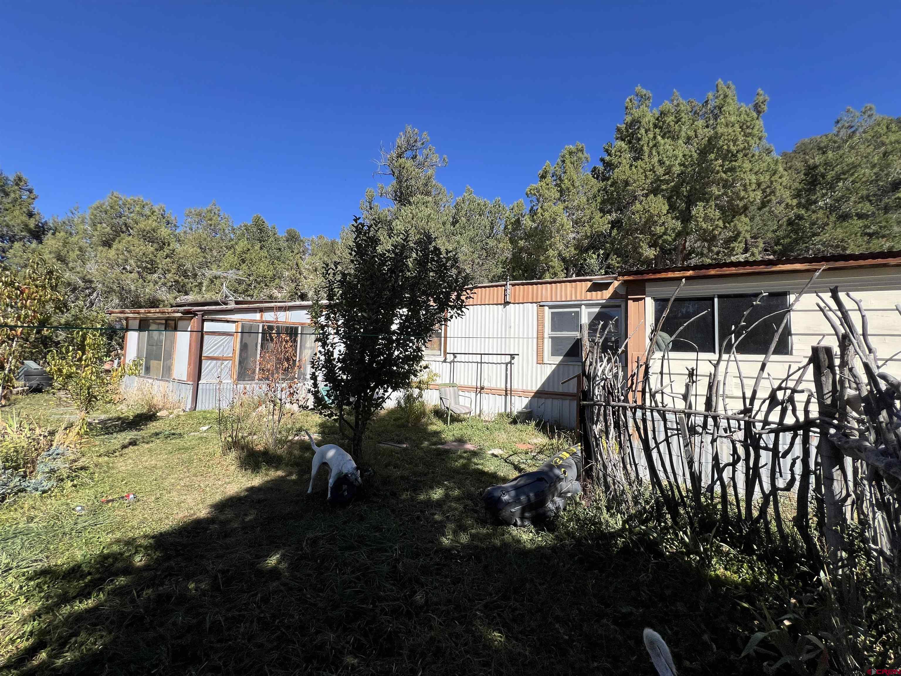 62 Range View Trail Ridgway, CO 81432 - Photo 3 of 21 a view of house with backyard and garden