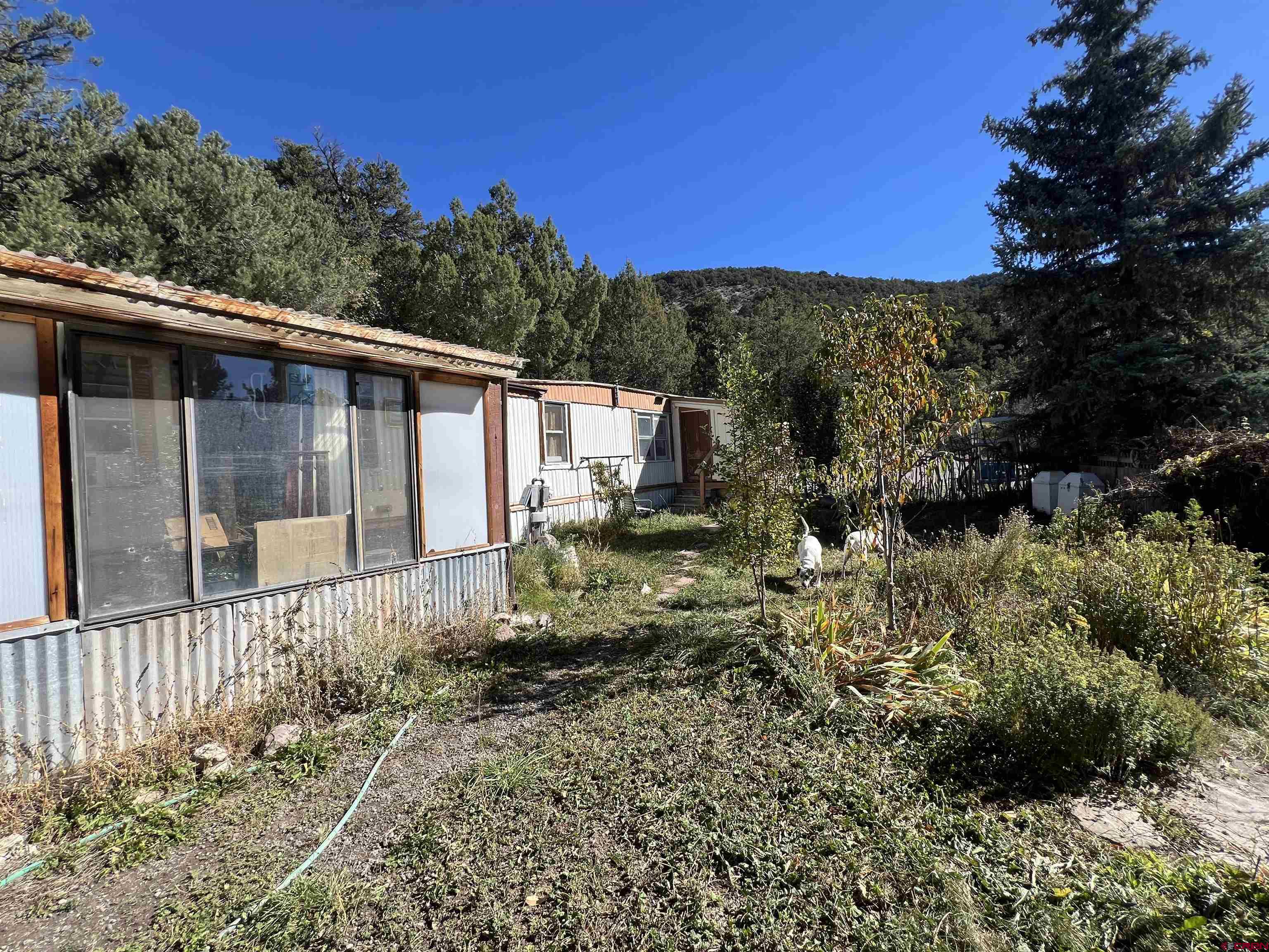 62 Range View Trail Ridgway, CO 81432 - Photo 4 of 21 a view of a house with a yard
