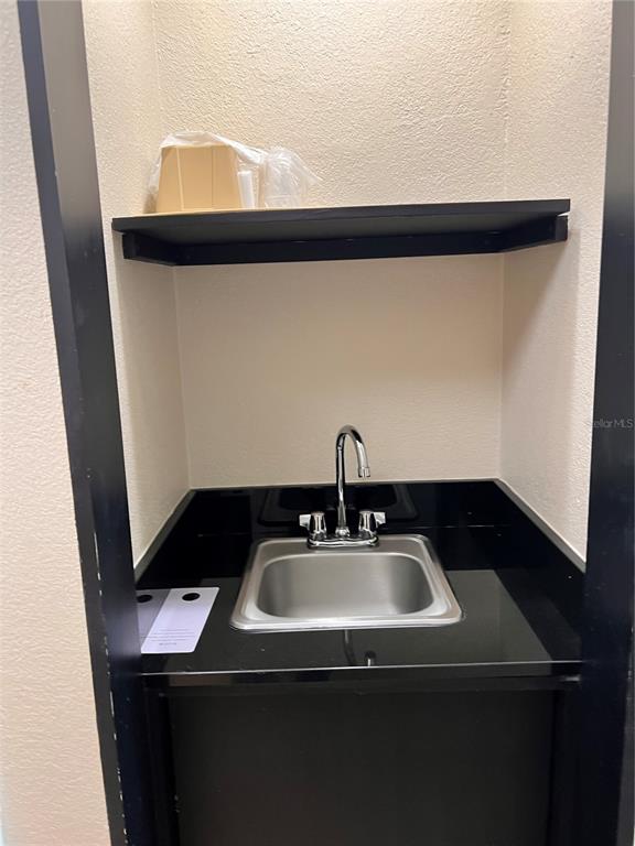 3000 Maingate Lane, Unit 506 Kissimmee, FL 34747 - Photo 11 of 18 a sink and a mirror