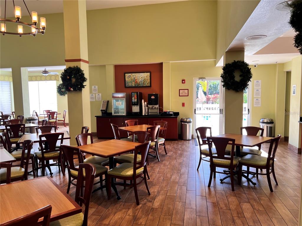 3000 Maingate Lane, Unit 506 Kissimmee, FL 34747 - Photo 16 of 18 a view of a dining room with furniture and chandelier