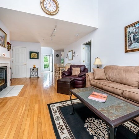 4 Red Cedar Road, Unit 4 Mashpee, MA 02649 - Photo 4 of 25 a living room with furniture and a wooden floor