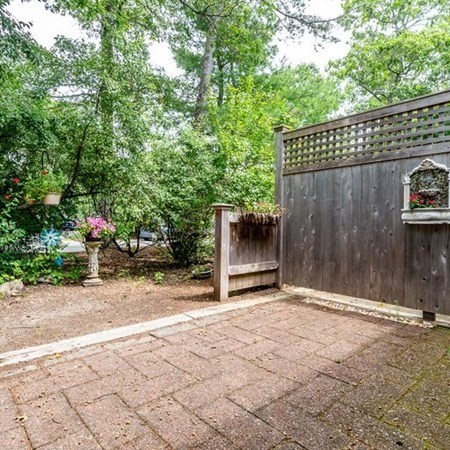 4 Red Cedar Road, Unit 4 Mashpee, MA 02649 - Photo 7 of 25 a view of a backyard