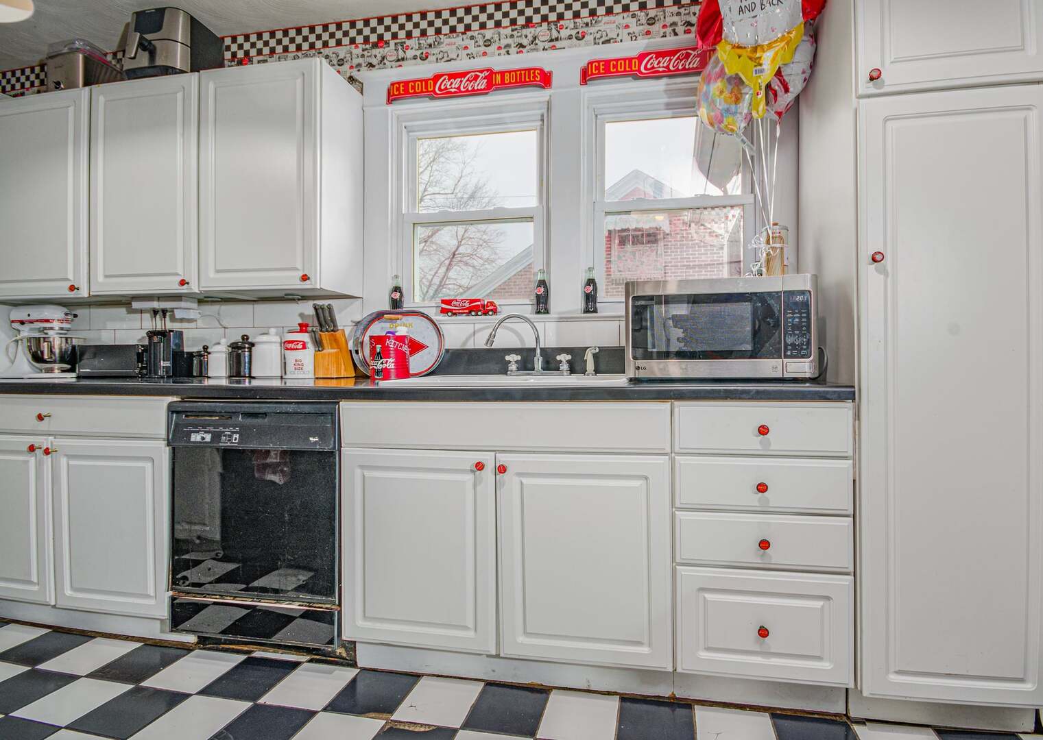 433 East Main Street Salem, IL 62881 - Photo 8 of 48 a utility room with stainless steel appliances cabinets and a window