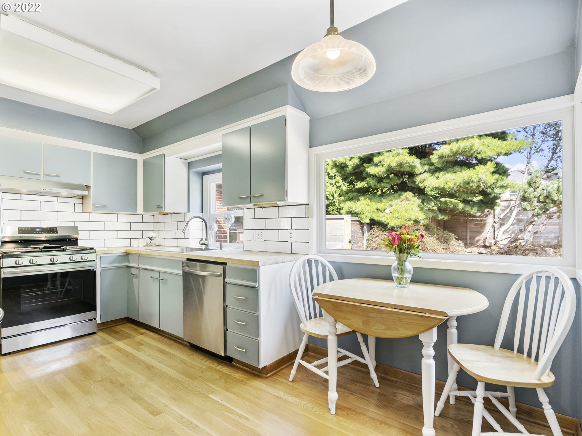 7320 Southwest Canyon Lane Portland, OR 97225 - Photo 12 of 32 a kitchen with a table and chairs in it