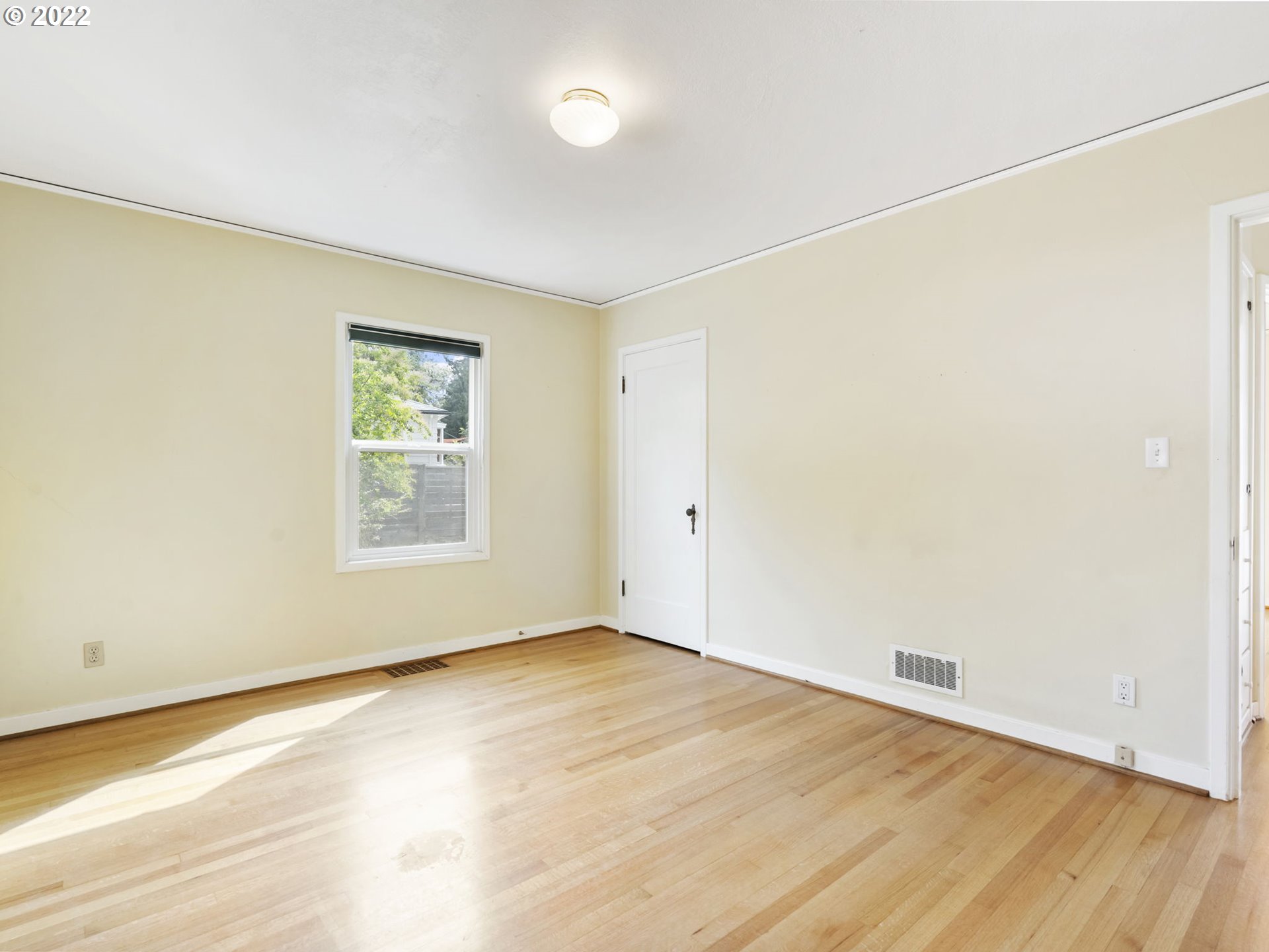 7320 Southwest Canyon Lane Portland, OR 97225 - Photo 16 of 32 an empty room with wooden floor and windows