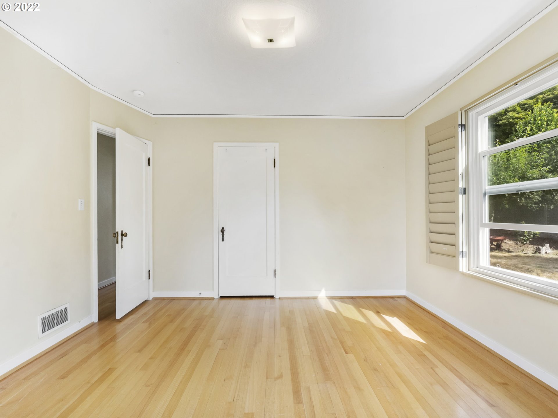 7320 Southwest Canyon Lane Portland, OR 97225 - Photo 18 of 32 a view of empty room with wooden floor and fan
