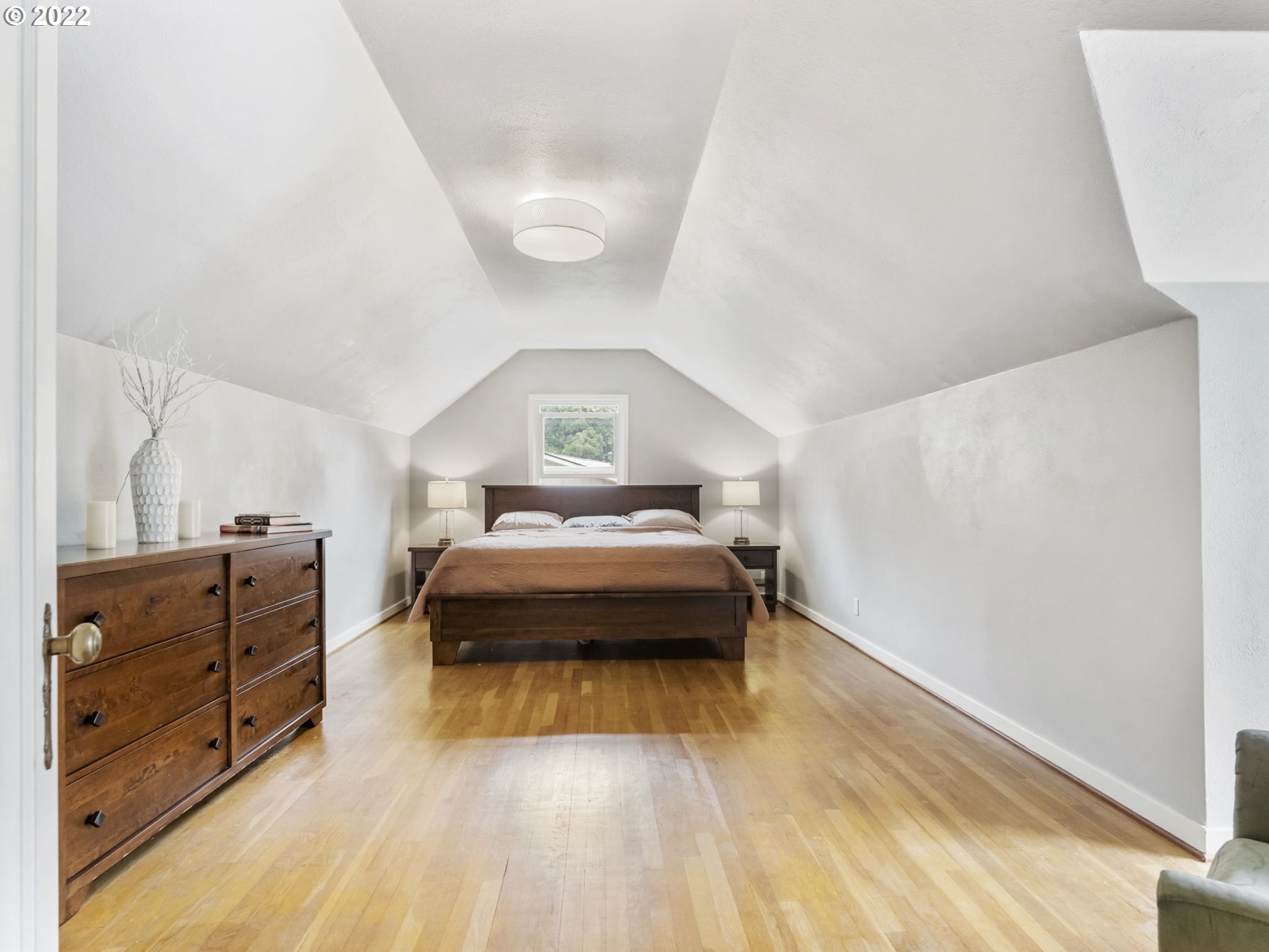 7320 Southwest Canyon Lane Portland, OR 97225 - Photo 20 of 32 a bedroom with a bed and wooden floor