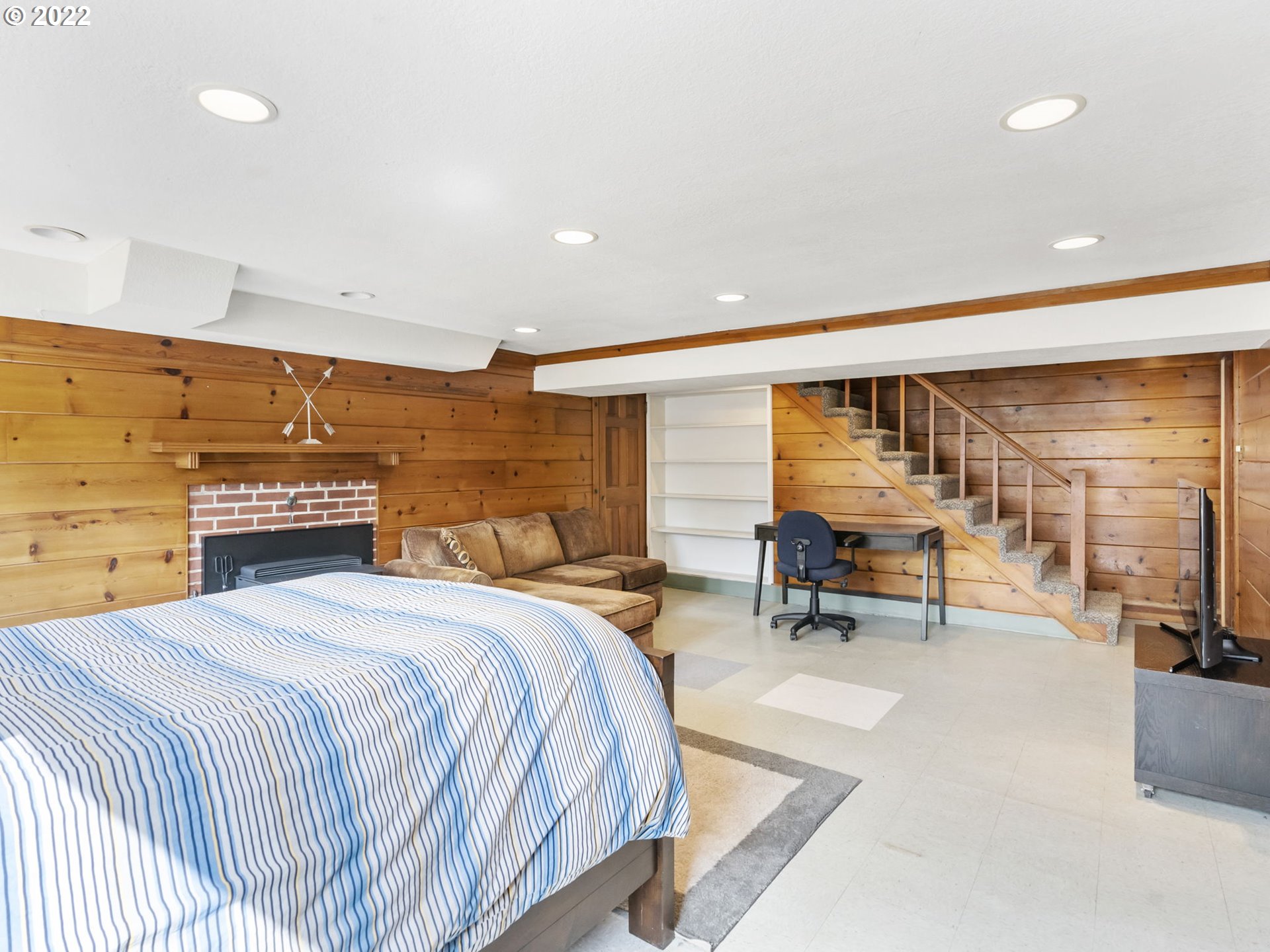 7320 Southwest Canyon Lane Portland, OR 97225 - Photo 27 of 32 a spacious bedroom with a bed a table and chair