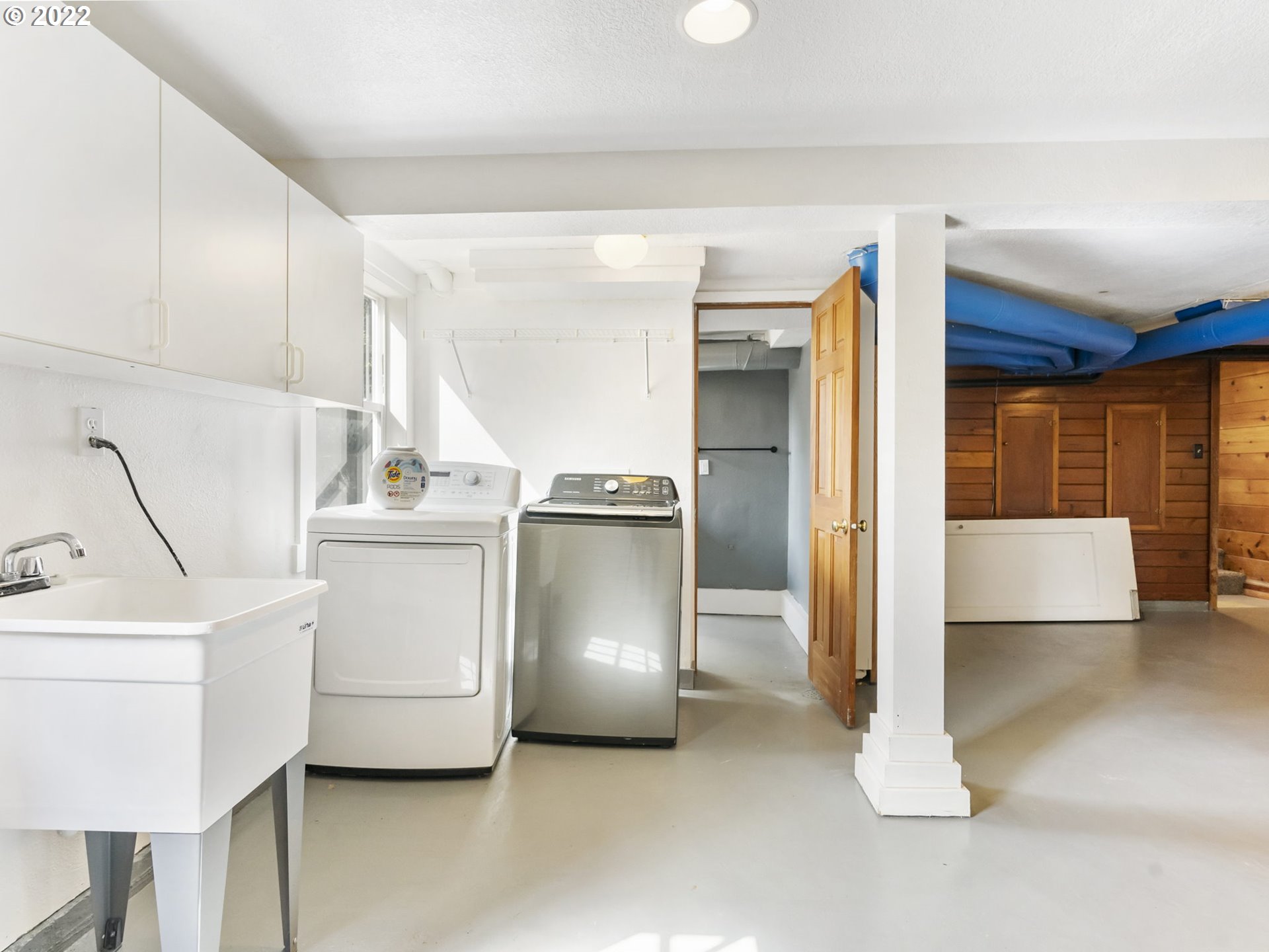7320 Southwest Canyon Lane Portland, OR 97225 - Photo 29 of 32 a view of kitchen with refrigerator and white cabinets