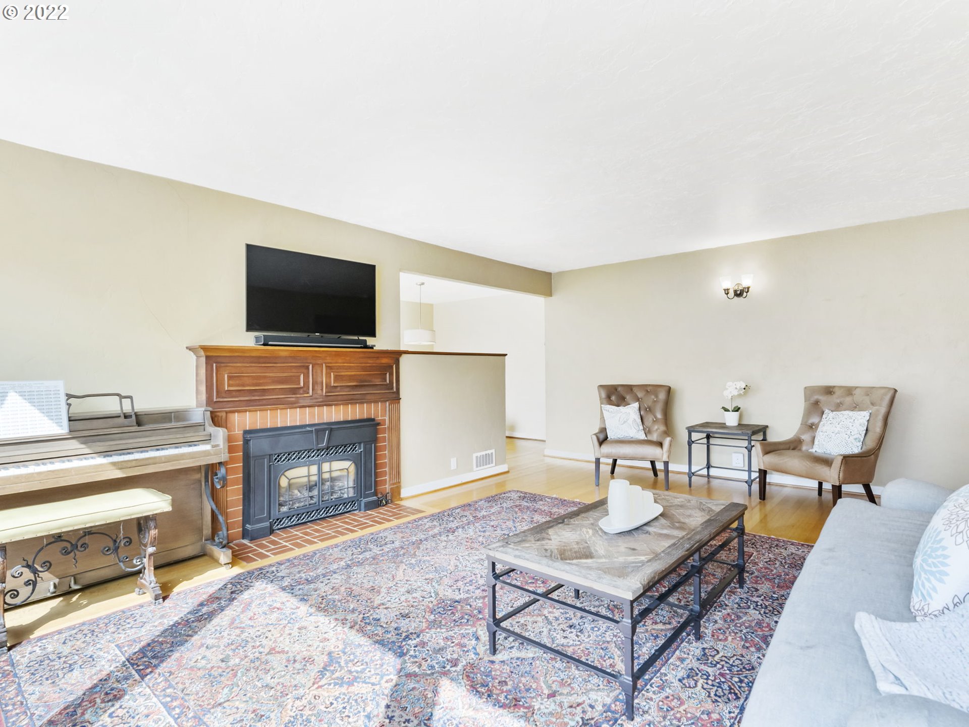 7320 Southwest Canyon Lane Portland, OR 97225 - Photo 5 of 32 a living room with furniture a flat screen tv and a fireplace