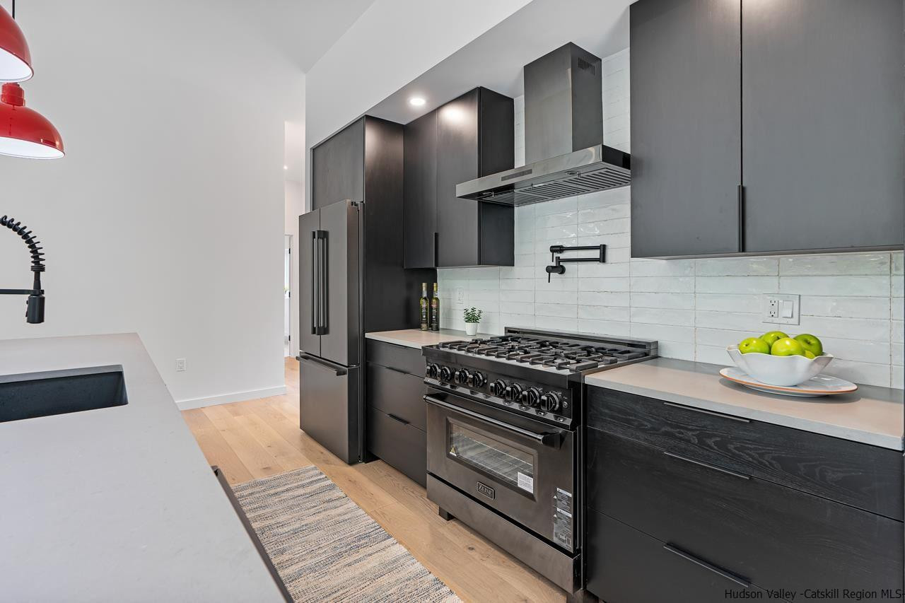 139 Krum Road Kerhonkson, NY 12446 - Photo 11 of 35 a kitchen with stainless steel appliances granite countertop a stove and a sink
