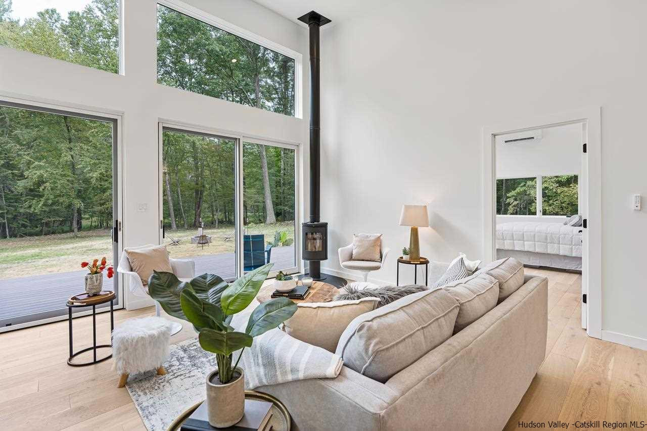 139 Krum Road Kerhonkson, NY 12446 - Photo 2 of 35 a living room with furniture and a large window