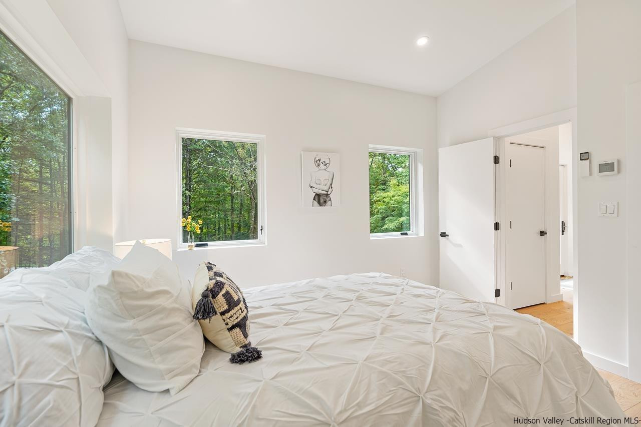 139 Krum Road Kerhonkson, NY 12446 - Photo 21 of 35 a bedroom with a bed and a window