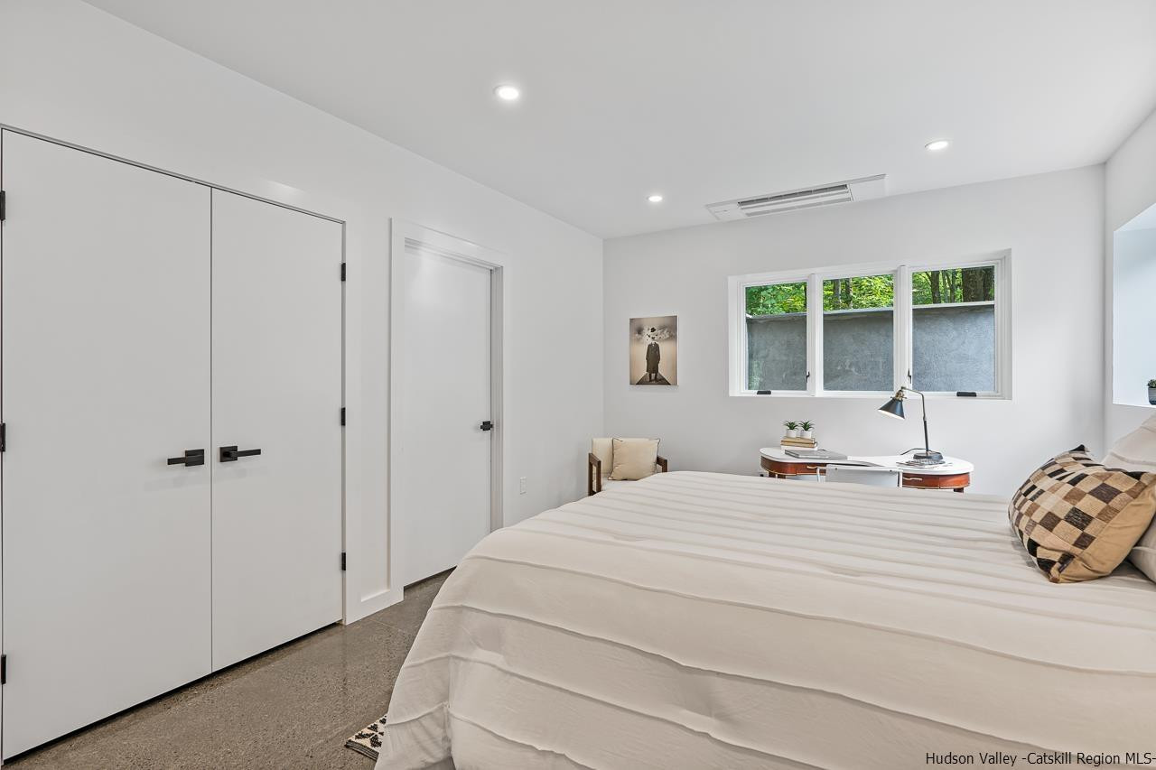 139 Krum Road Kerhonkson, NY 12446 - Photo 27 of 35 a bedroom with a bed a window and a dresser