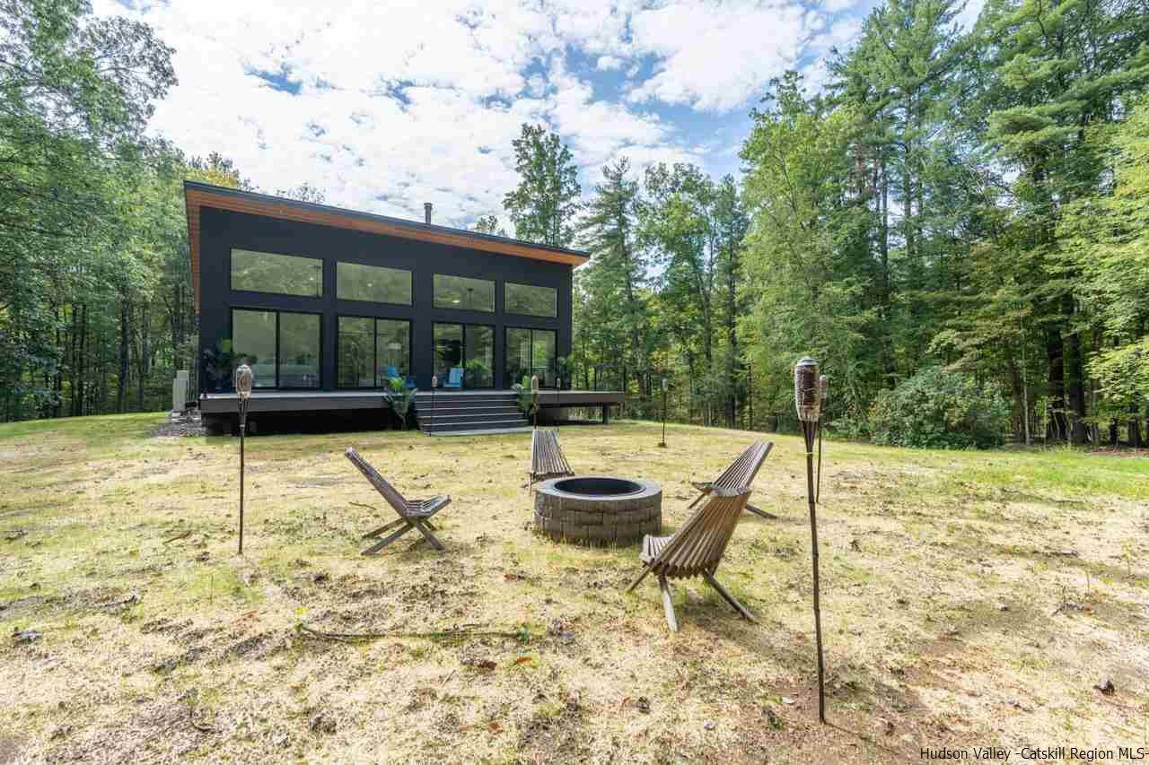 139 Krum Road Kerhonkson, NY 12446 - Photo 29 of 35 a swimming pool with potted plants and large trees