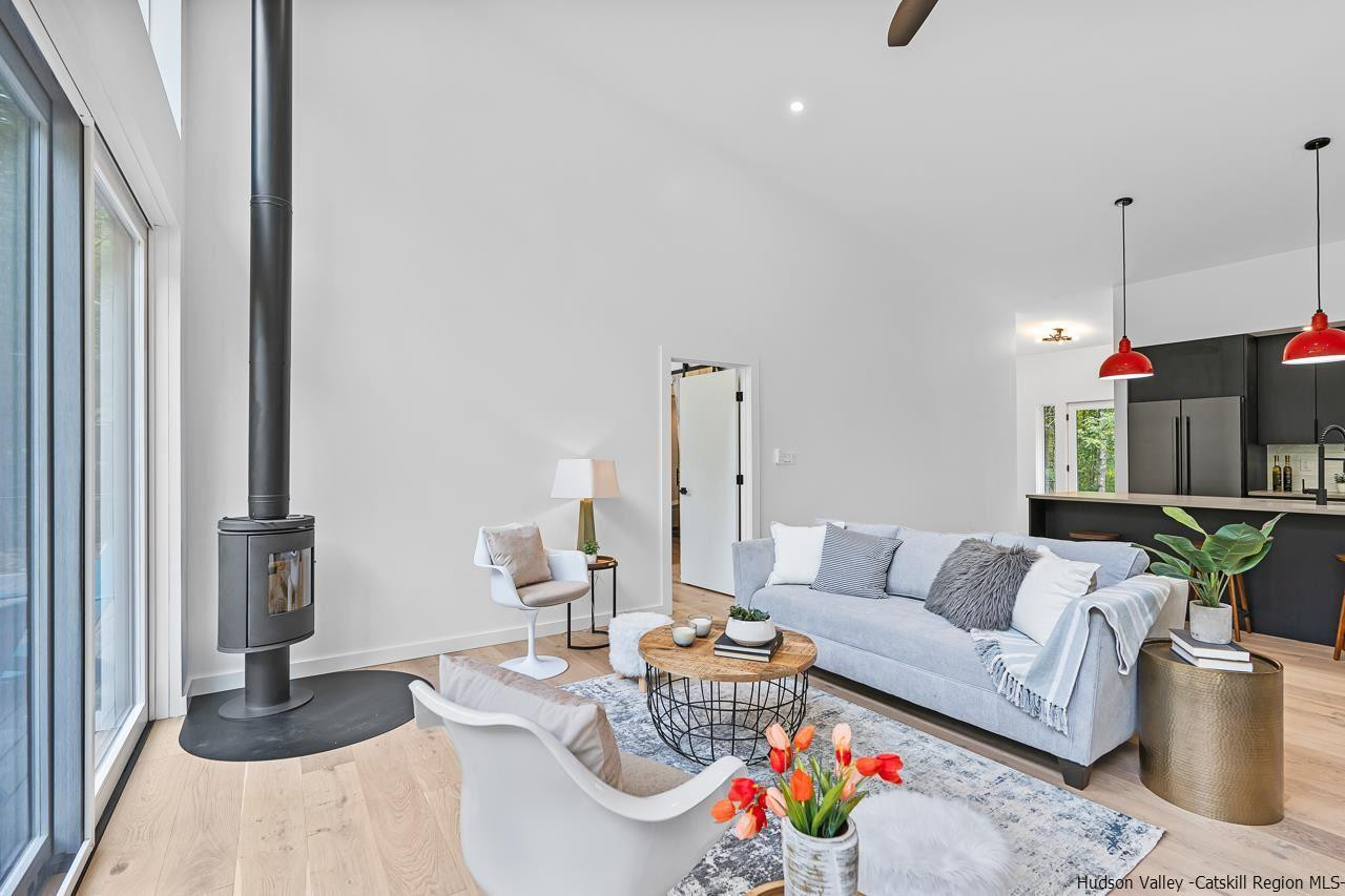 139 Krum Road Kerhonkson, NY 12446 - Photo 3 of 35 a living room with furniture and a floor to ceiling window