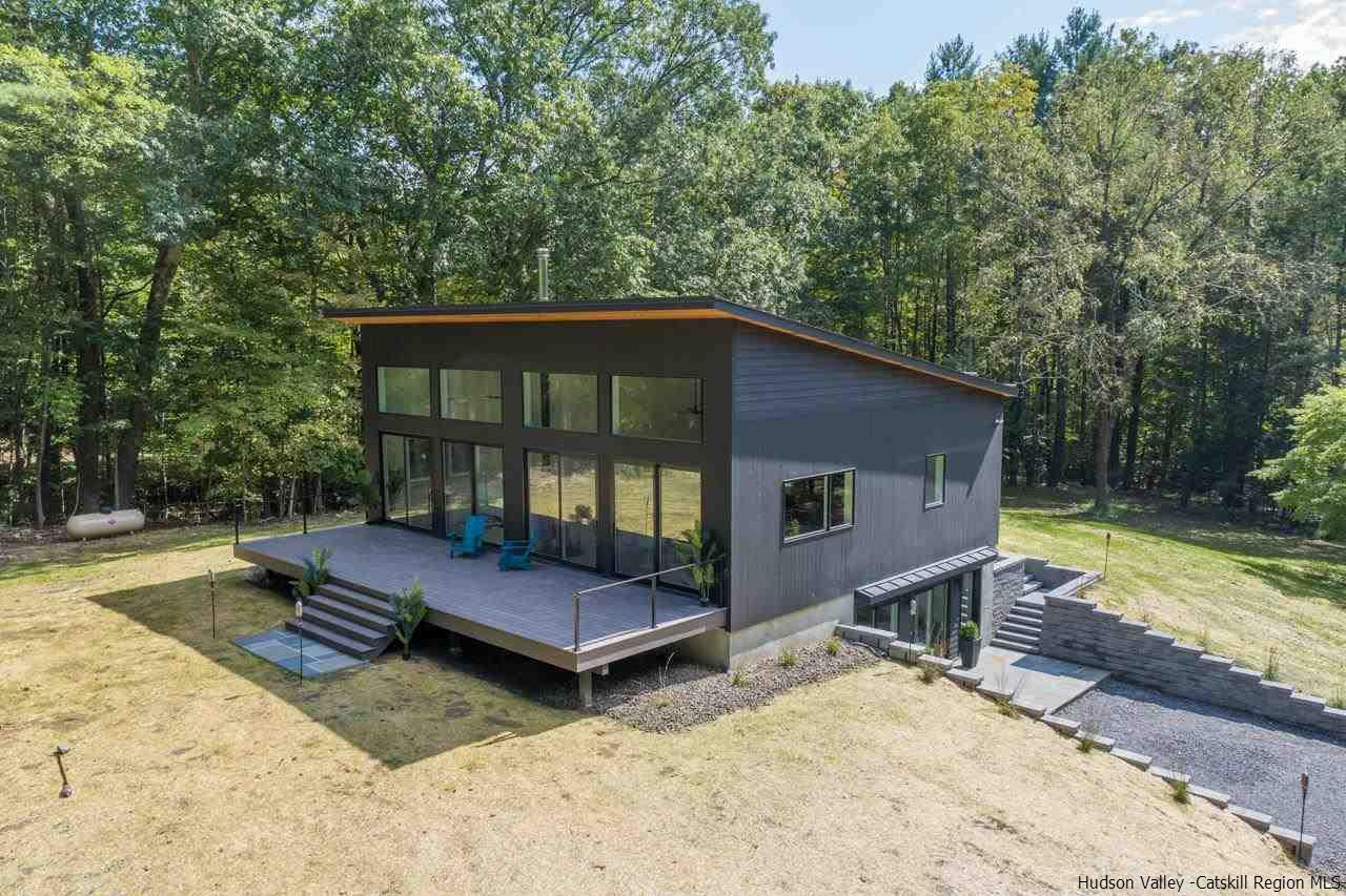 139 Krum Road Kerhonkson, NY 12446 - Photo 31 of 35 a backyard of a house with barbeque oven table and chairs
