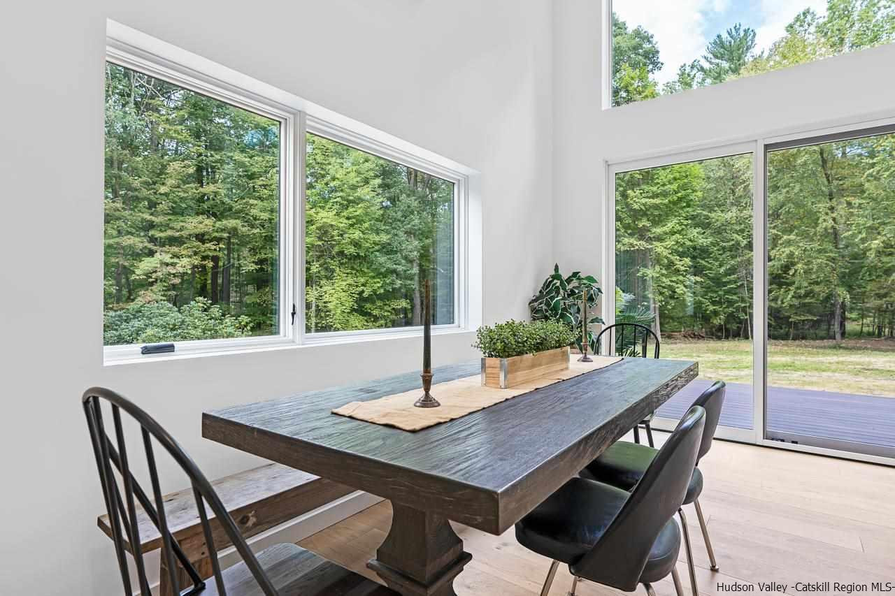 139 Krum Road Kerhonkson, NY 12446 - Photo 6 of 35 a view of a dining room with furniture window and wooden floor