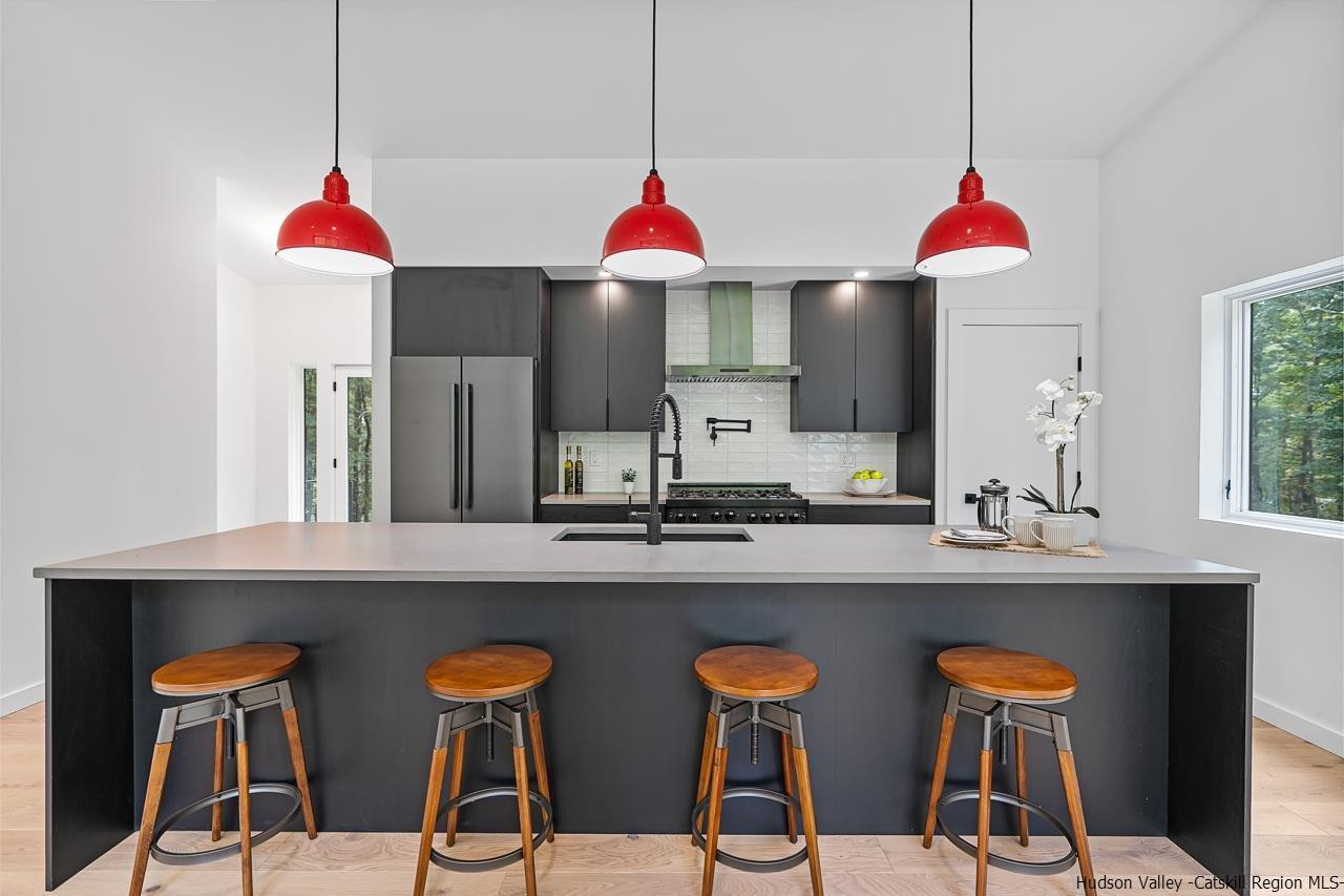 139 Krum Road Kerhonkson, NY 12446 - Photo 9 of 35 a view of a kitchen with a table and chairs
