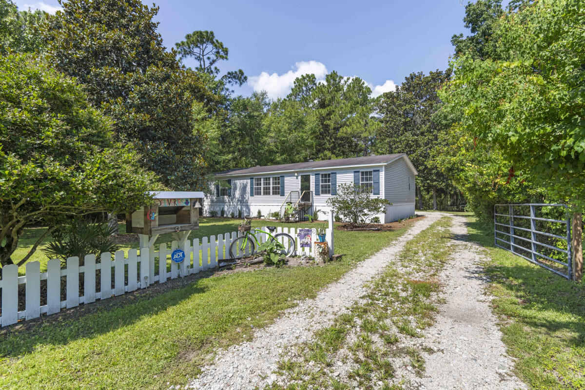 27 4th Street Santa Rosa Beach, FL 32459 - Photo 1 of 24 a view of house with a yard and furniture