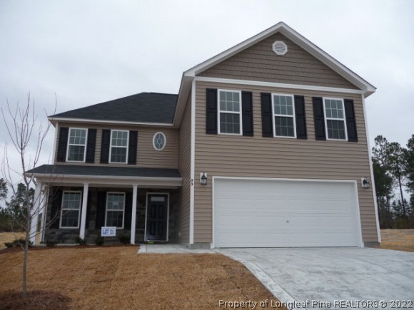 89 Loyalist Road Cameron, NC 28326 - Photo 1 of 1 front view of a house with a yard