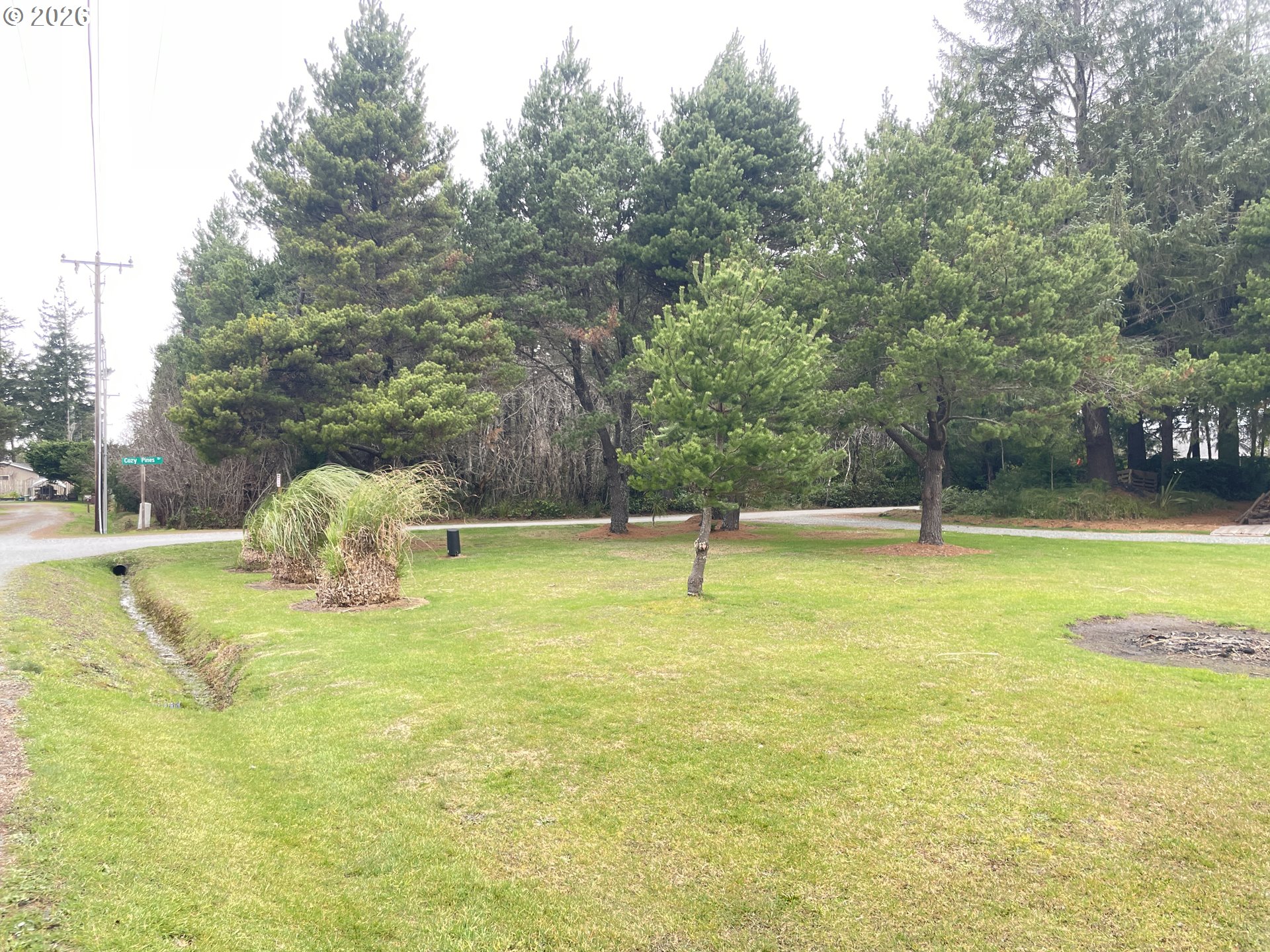 Cozy Pines Bandon, OR 97411 - Photo 4 of 13 a view of swimming pool with a yard