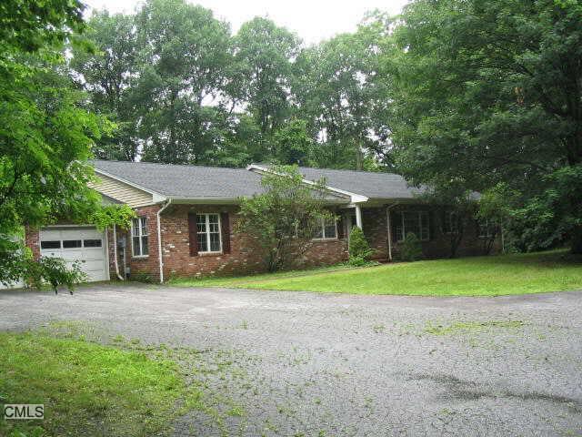 181 Bacon Road Roxbury, CT 06783 - Photo 1 of 1 a front view of a house with a yard and trees