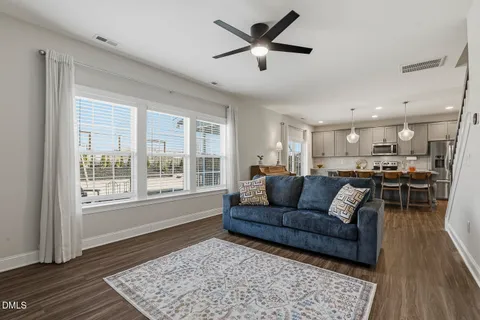 a living room with furniture flat screen tv and a fireplace