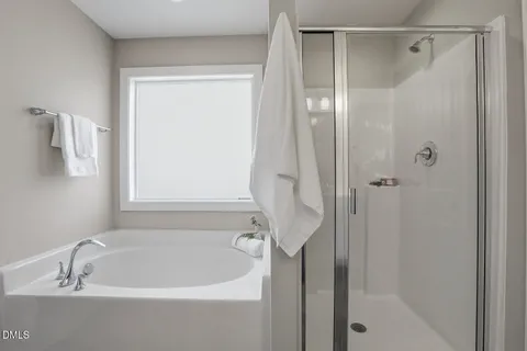 a bathroom with a sink vanity and mirror
